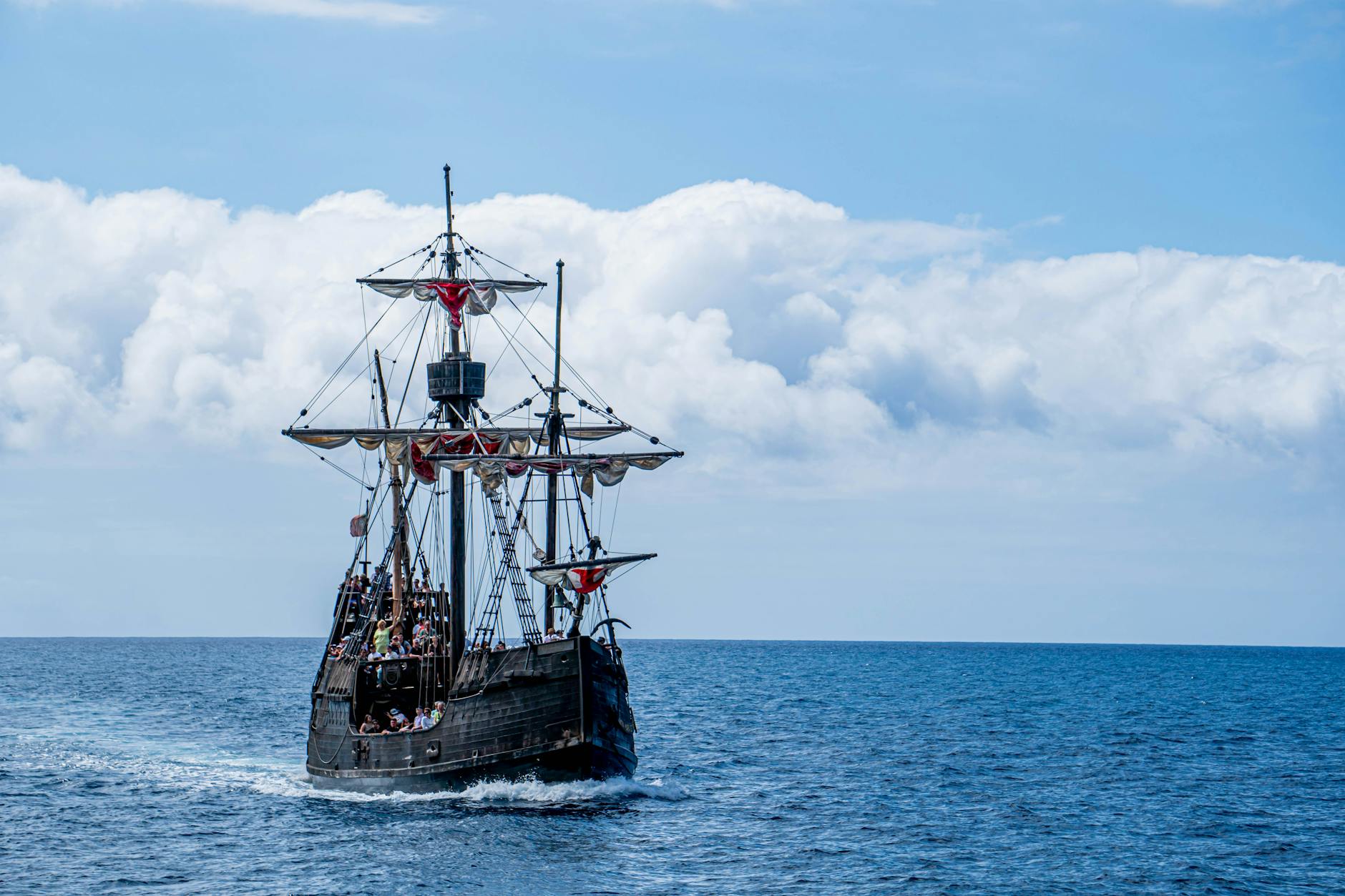 a pirate ship sailing in the ocean